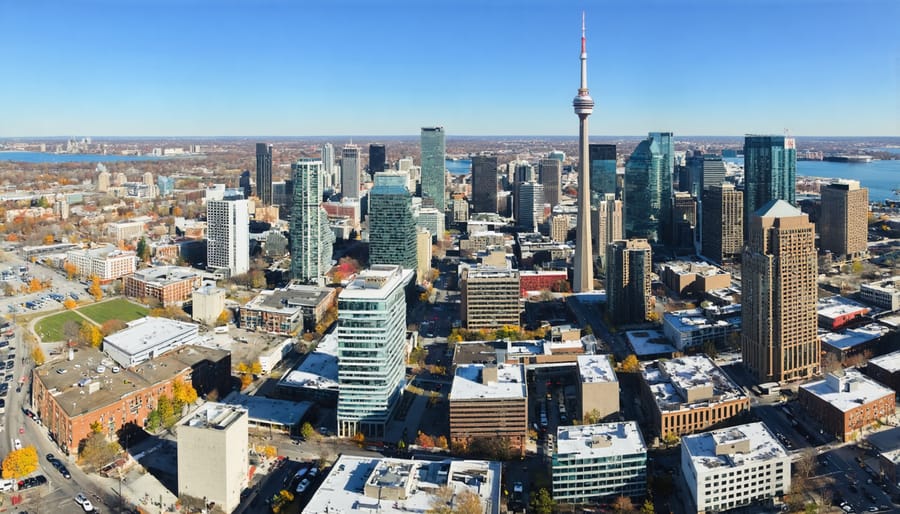 Aerial view of Toronto's downtown skyline featuring the CN Tower and diverse urban neighborhoods